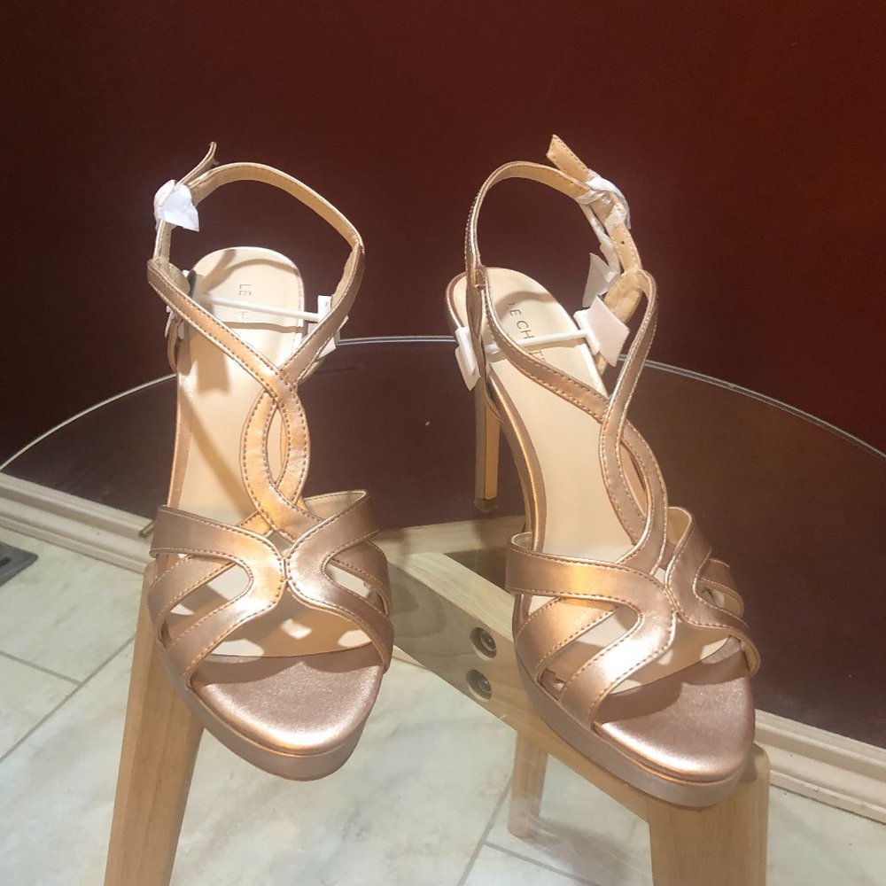 Brand new Le chateau golden wedding heels .